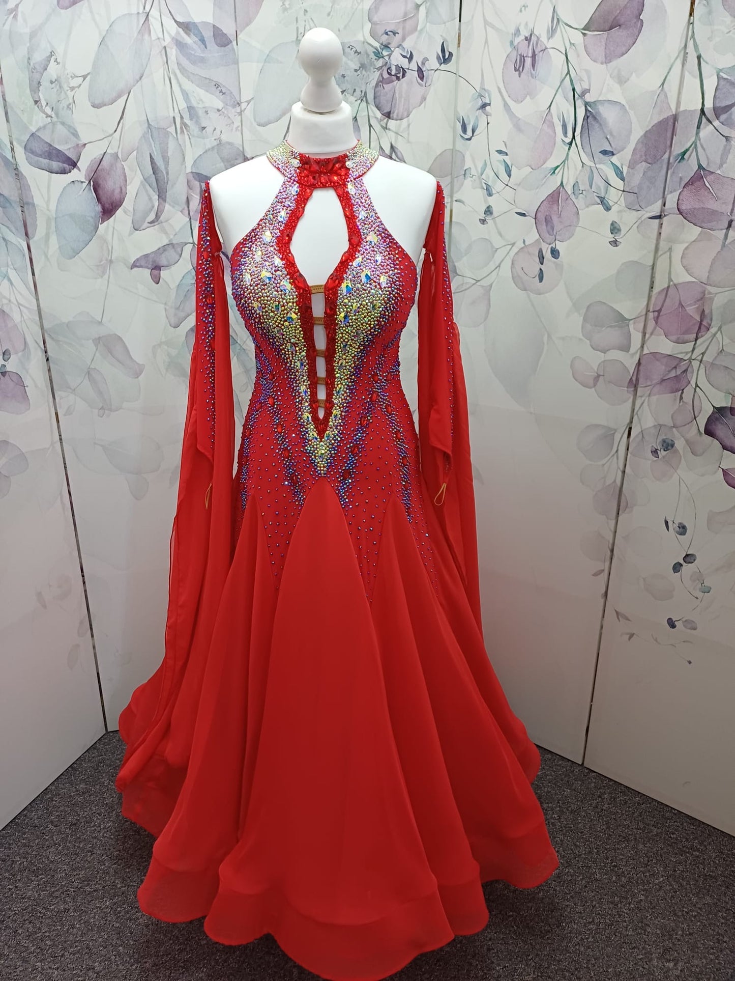 61B Bright Red Competition Ballroom/Sequence Dance Dress. Open detailing to the centre front, heavily stoned in Light Siam, AB & Siam AB. Beautiful Key hoke detail at neck. ❤️Showroom Appointments Available❤️
