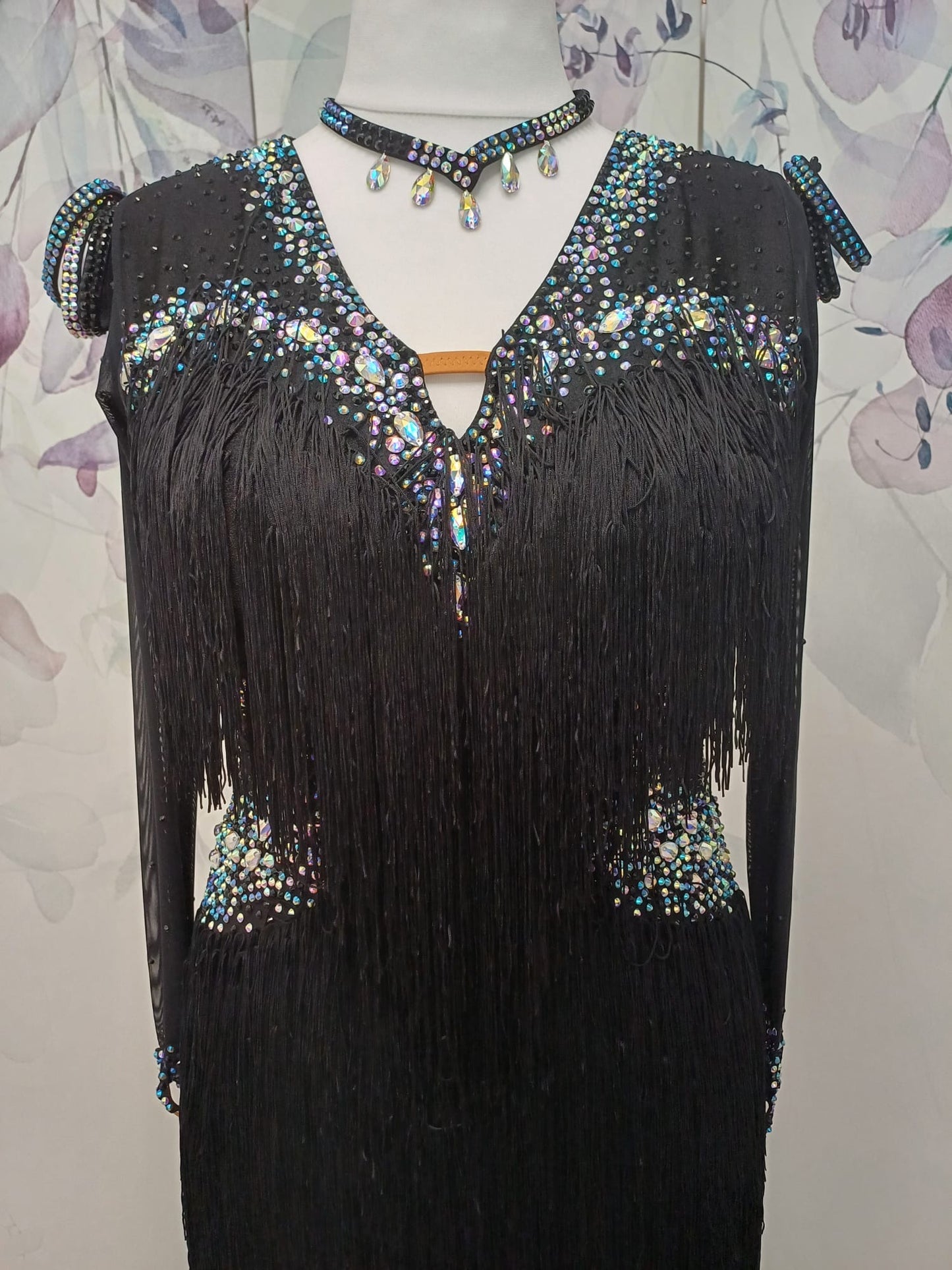00111 Stand out stunning black fringed Latin Dance Dress. Full fringe giving maximum movement on the floor. Stoned in Jet, AB & Sapphire ab. High back to give option of wearing own bra.