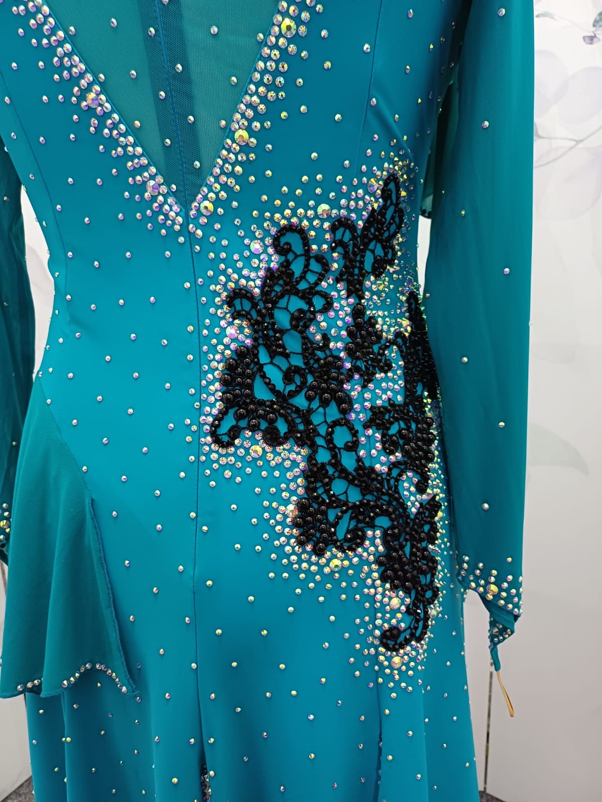 60L Teal Competition Latin Dance Dress. Beautiful Teal colour. Black pearls & AB stones with overlay detail to the chest & Back hip giving flattering lines. ❤️Showroom Appointments Available❤️