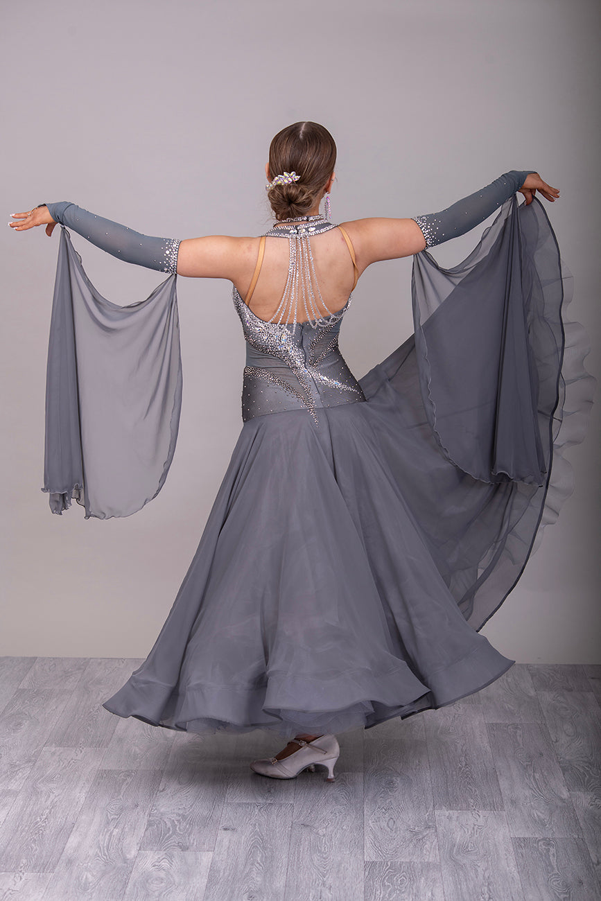 18B Hematite Ballroom/Sequence Competition Dance Dress. Heavily Stoned in AB, Moonlight & Jet Hematite. Detachable Floats & extra Feather Cuffs. Necklace with hanging details to the back.
