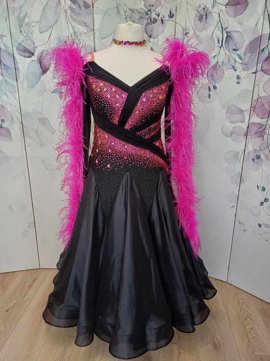 308 Stand out stunning Competition Ballroom Dance Dress. Heavily stoned in Fuchsia, Fuchsia AB, & Jet. Cold should with mesh over shoulder piece. Very fluffy Ostrich Feather Boa floats.