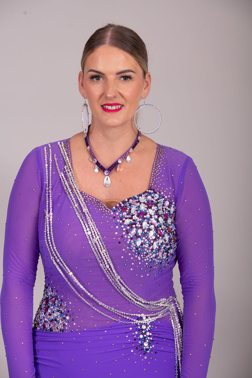 116L Stand Out Purple Competition Latin Dance Dress. Hanging strap detail to the front with stone detail in Purple velvet, AB & light amethyst AB.  High Back to give option of wearing own bra