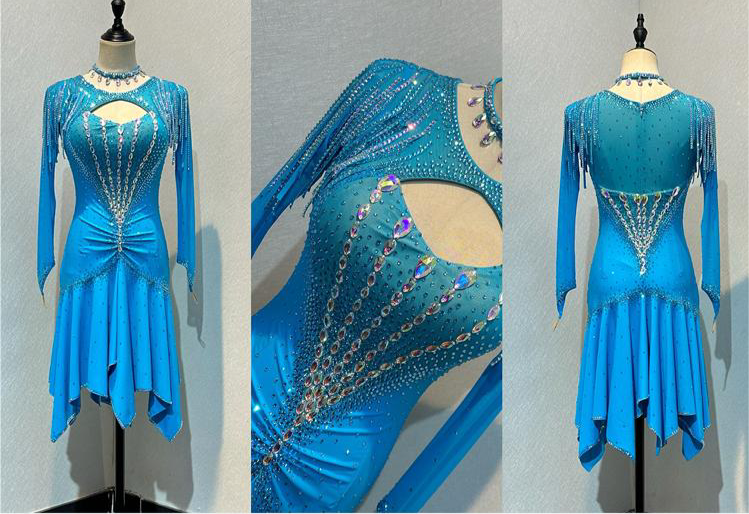 48L Light Turquoise Competition Latin Dance Dress. Stoned in AB & Aquamarine with stoned tassels & upper chest keyhole detail to the front. Rouching detail to the upper hip. Very full skirt for maximum movement. ❤️Showroom Appointment Available❤️