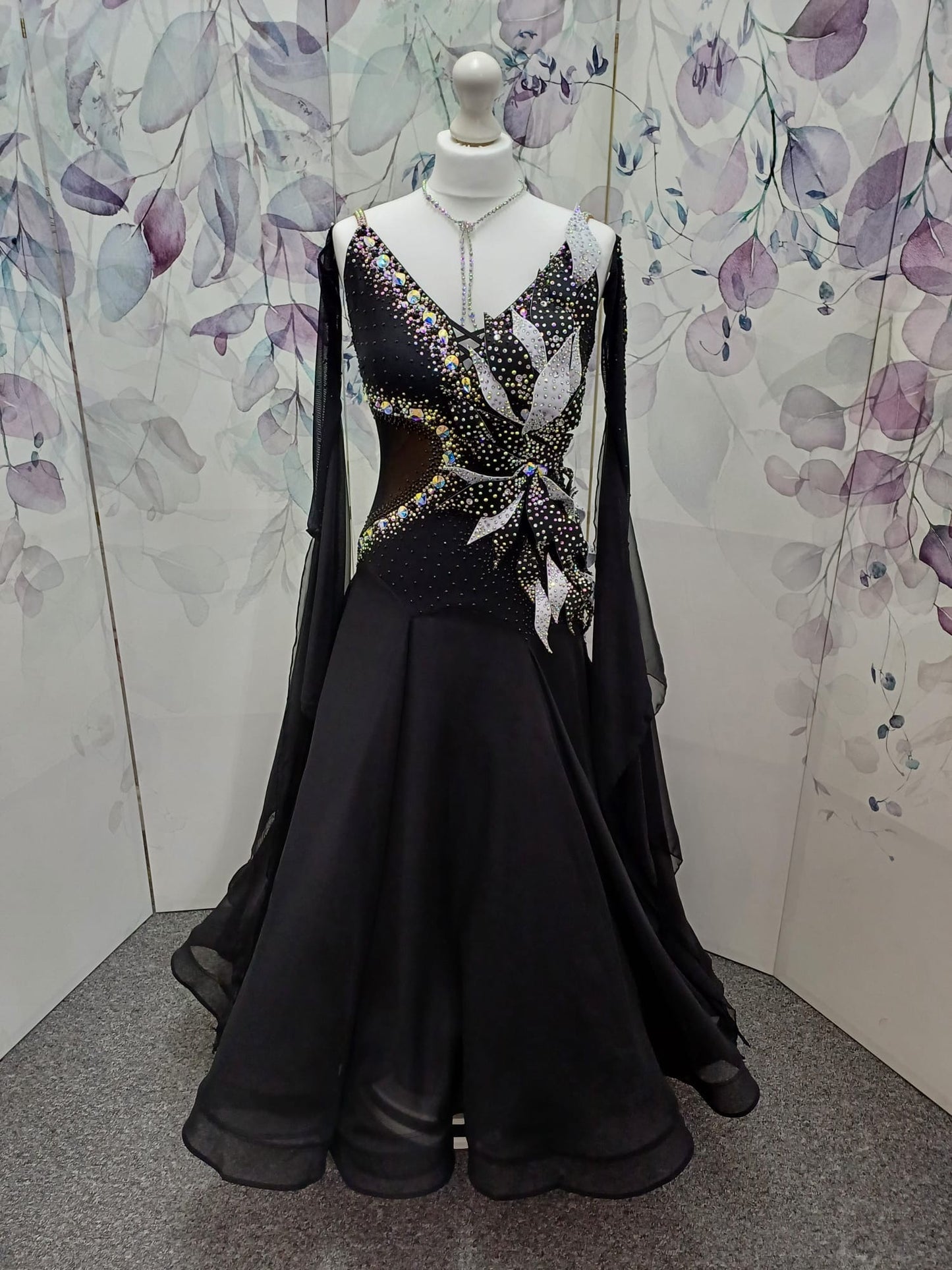 58B Gorgeous Black Ballroom/Sequence Competition Dance Dress. 3D Design to right side of bodice. Heavily stoned in jet & AB. ❤️Showroom Appointments Available ❤️