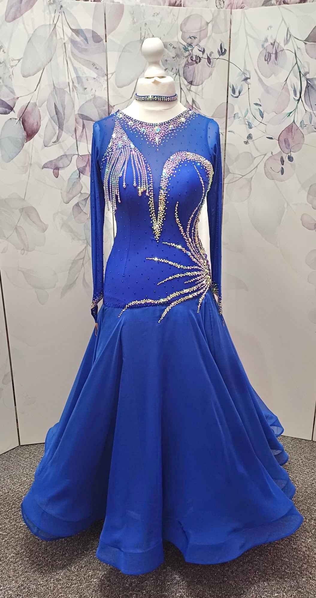 098 Royal Blue Competition Dance Dress. Heavily stoned with AB & Sapphire. Hanging strip details to upper right chest. High back giving option to wear own bra.