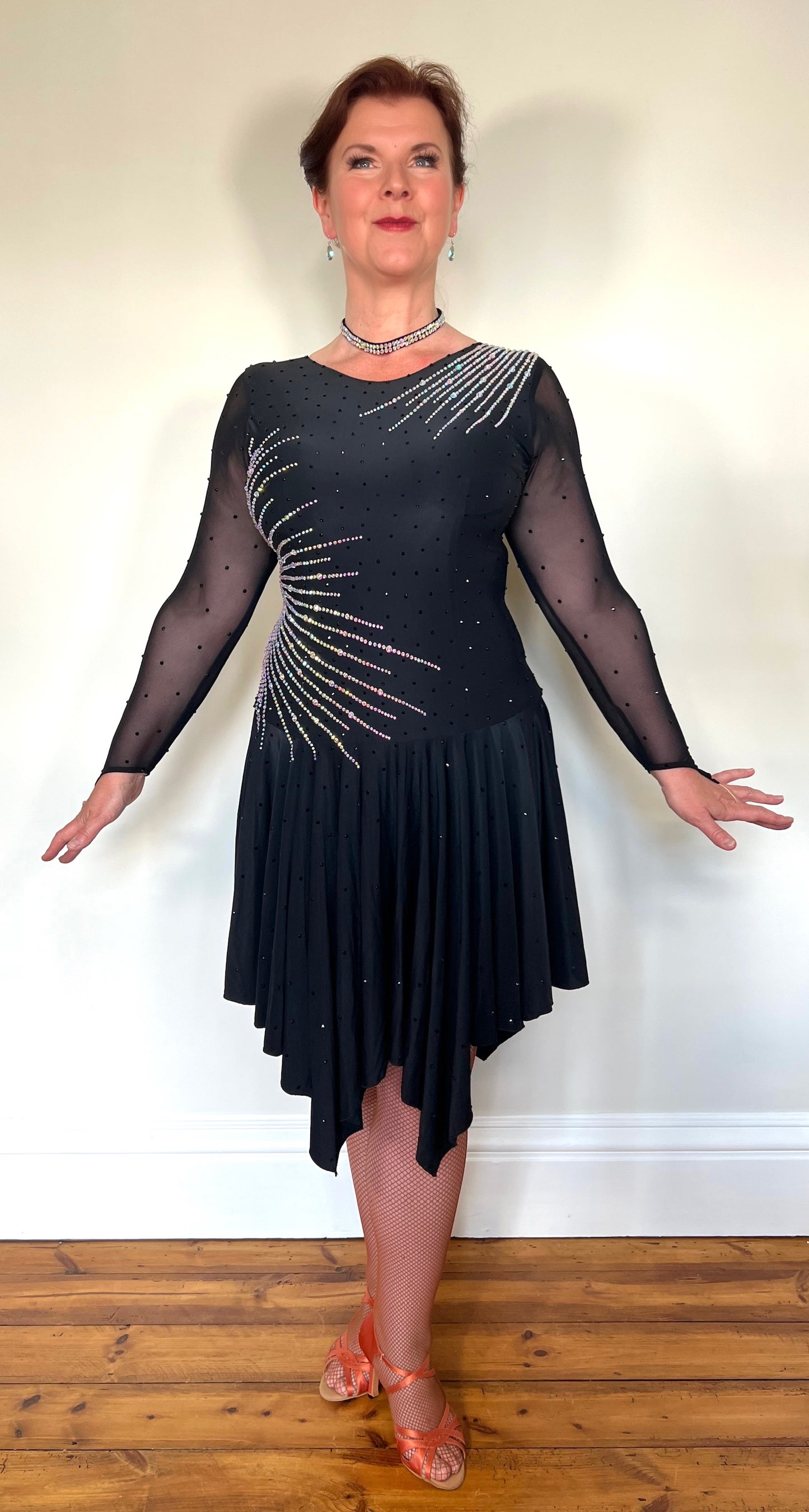 199 Flattering Black Latin Dance Dress. Super Stretchy. Stoned in AB starburst design with handkerchief hem skirt. High back giving option for wearing own bra.