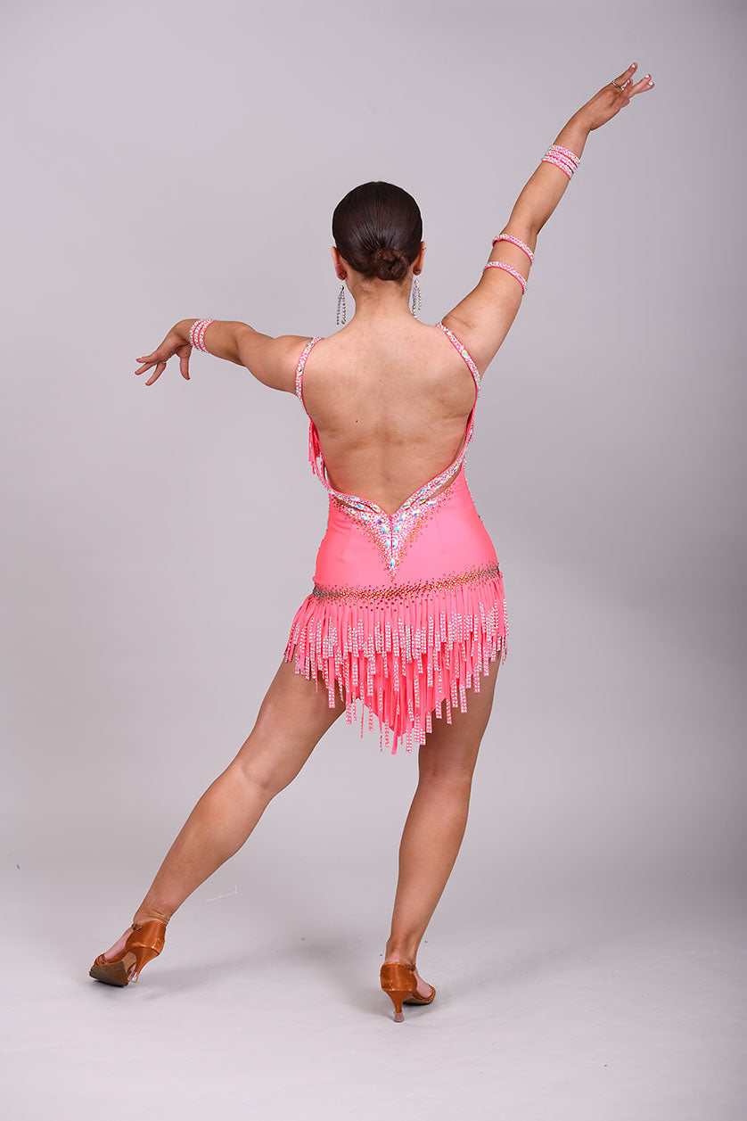 003 Coral Competition Latin Dance Dress. Full stoned fabric fringe details to chest and skirt. Includes bracelets. Stoned in AB & Hyacinth AB