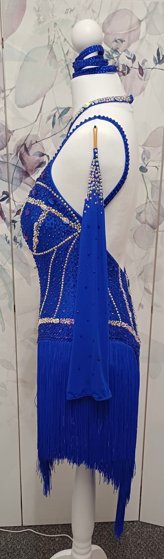 014 Royal blue Competition Latin Dance Dress. Heavily stoned in AB & Sapphire. Full fringed skirt for maximum movement. Neck detailing. Comes with long stoned gloves & Bracelets