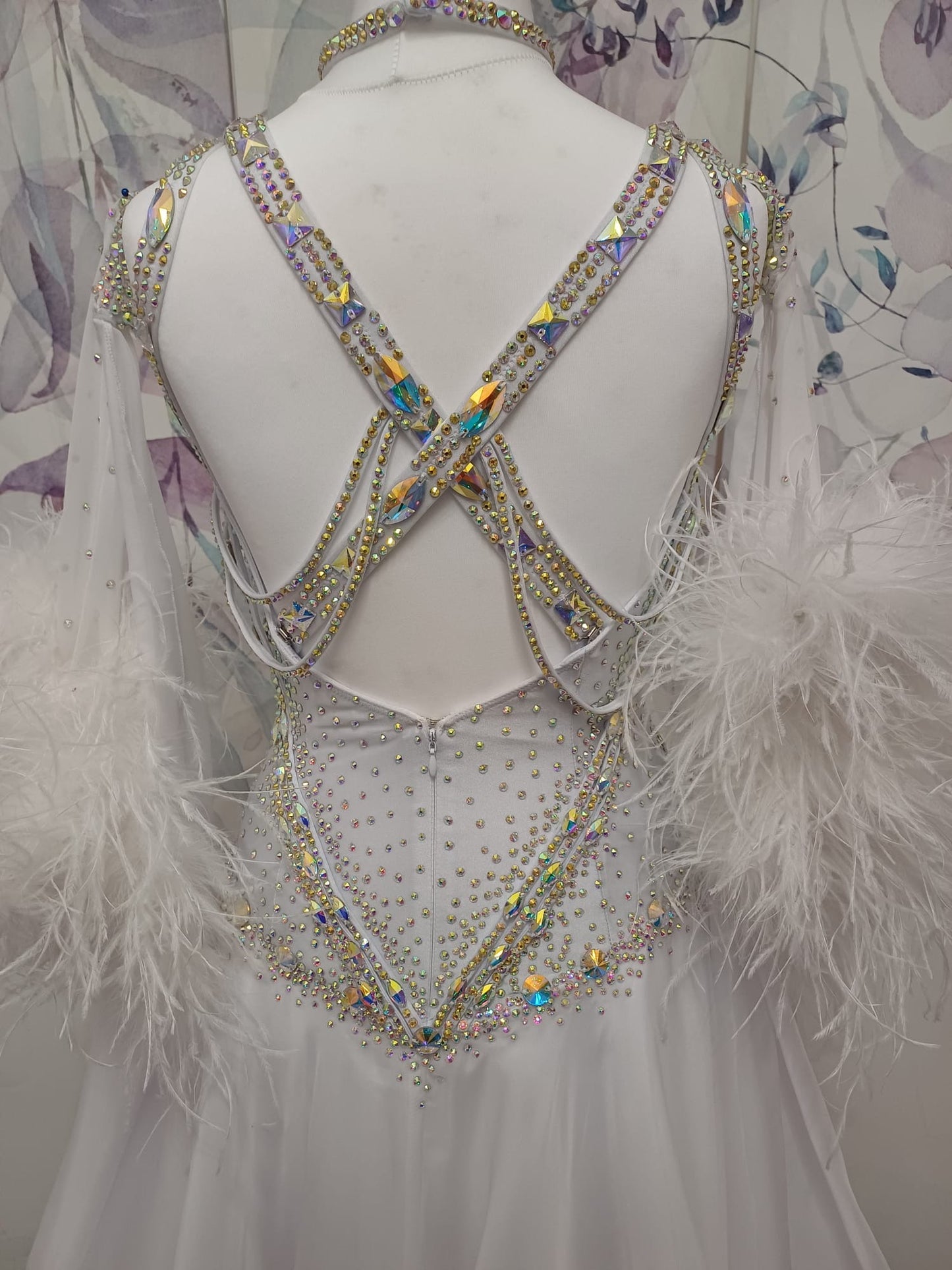 013 White Competition Ballroom/Sequence Dance Dress. Striking detailing to both the front & Back. Stoned in AB and sunshine. Cones with gloves, floats & Ostrich Boa cuffs.