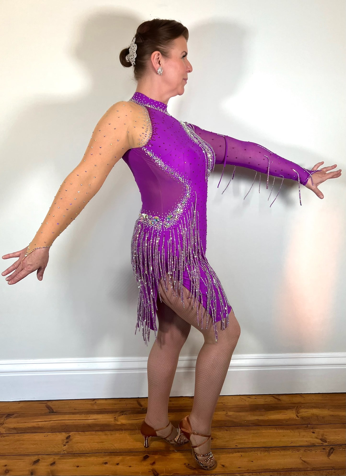 060 Bright Magenta Competition Latin Dance Dress. Flesh sleeve to one arm. Stoned dropper detailing throughout.
