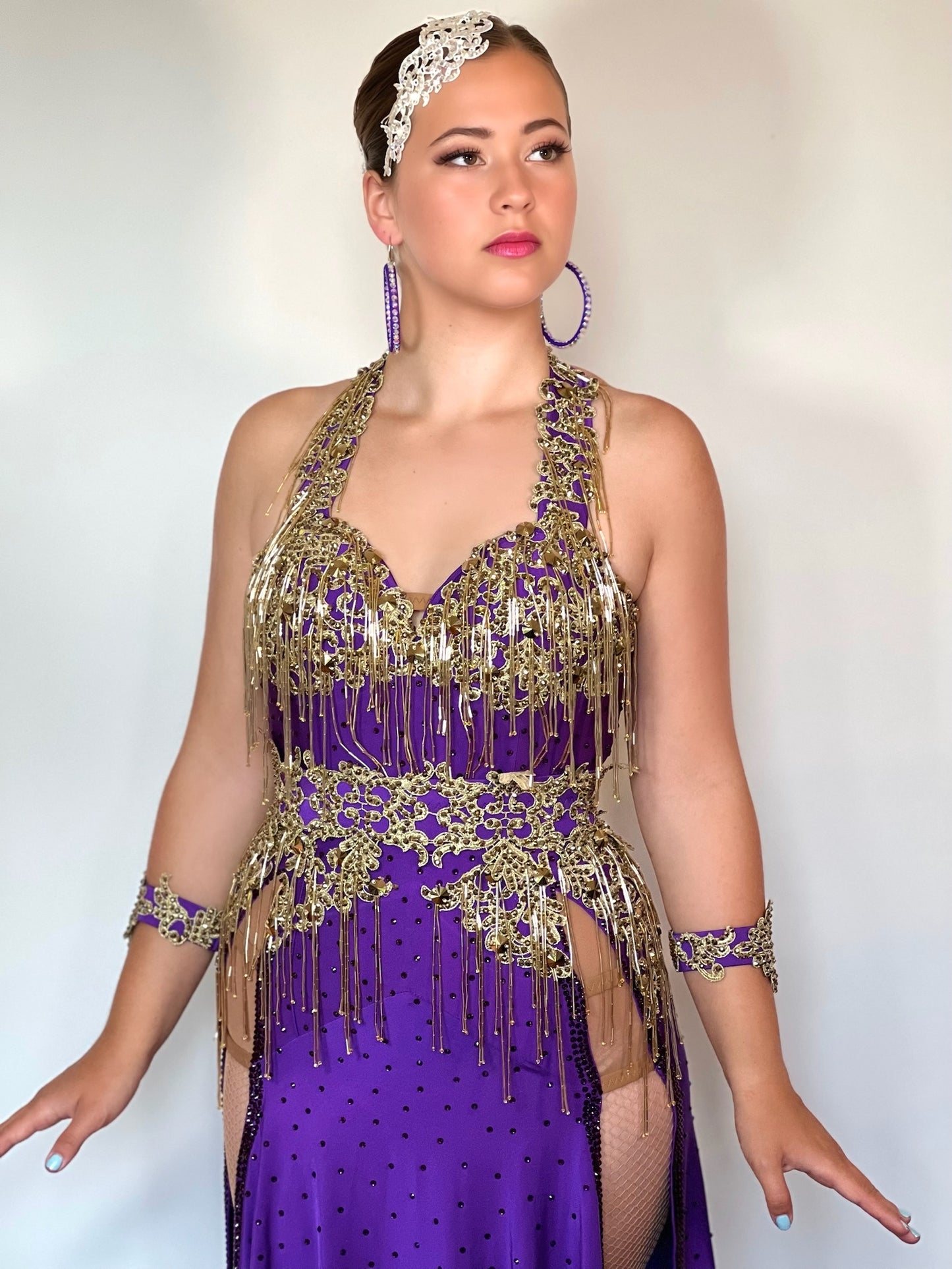 089 Purple & Gold heavily decorated Latin  Dress. Gold bead droppers, gold metallic appliqué & gold stones. Detachable belt with main dress stoned in purple velvet