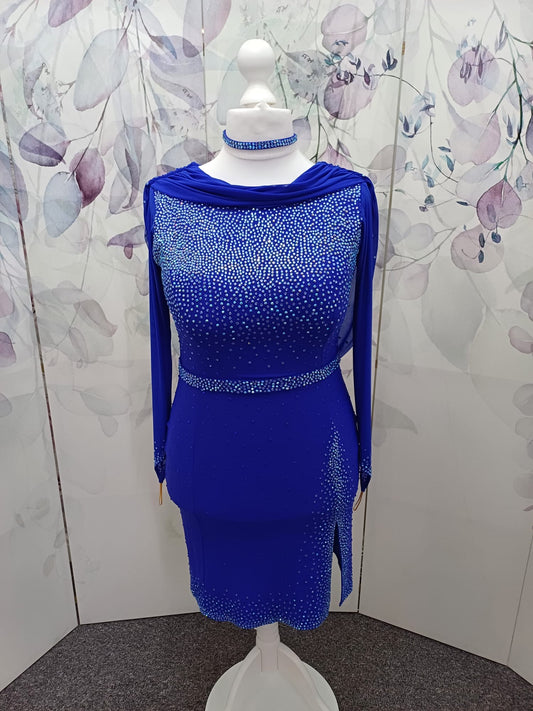 26L Royal Blue Latin Competition Dance Dress. Optional Belt. Sash detail to the neck & back. High stoned back to allow option to wear own Bra. Stoned in Light Sapphire, Light Sapphire AB & Sapphire