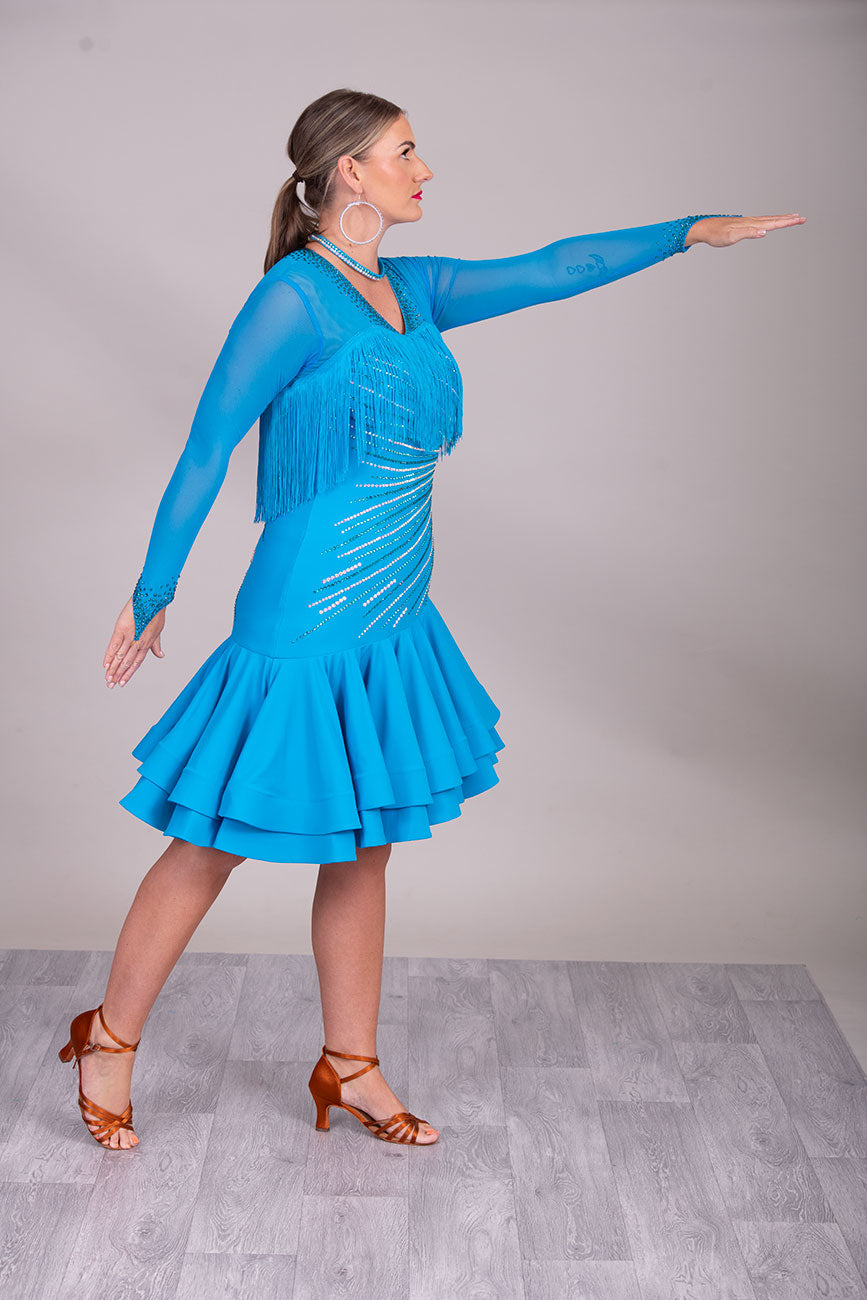 126L Gorgeous Blue Latin Competition Dance Dress. High Back allowing option to wear own Bra
Very flattering design to the tummy/hip with full deep frill skirts for maximum movement & fringes to the upper chest