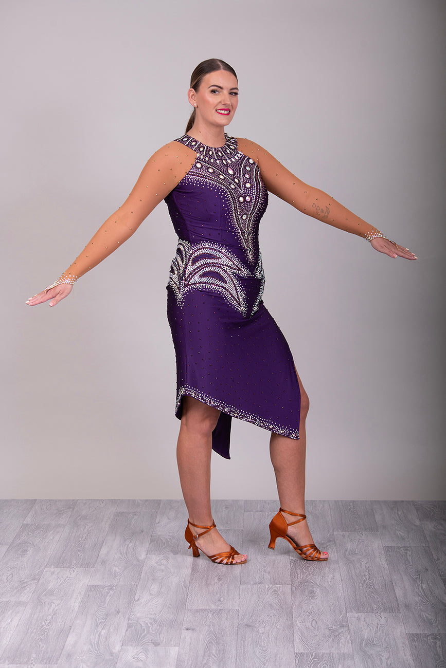 0002 Deep Purple Latin Dress. Heavily stoned in Amethyst, Light Amethyst & AB. Keyhole feature to the back, touching detail at the front.