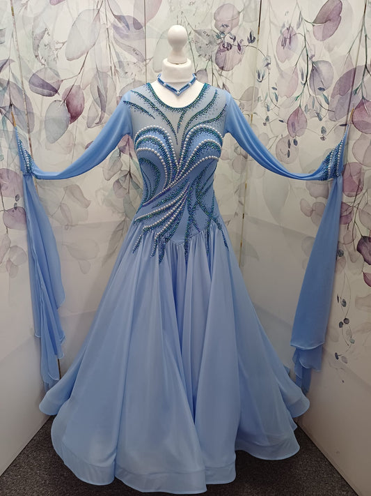 60B TWD ELITE Sky Blue Competition Ballroom/Sequence Dance Dress. New Fuller skirts & Underskirts. Beautiful patterning in Light Sapphire, AB & Light Sapphire AB with White Pearls. Narrow keyhole back. Detachable floats.❤️Showroom Appointments Available❤️
