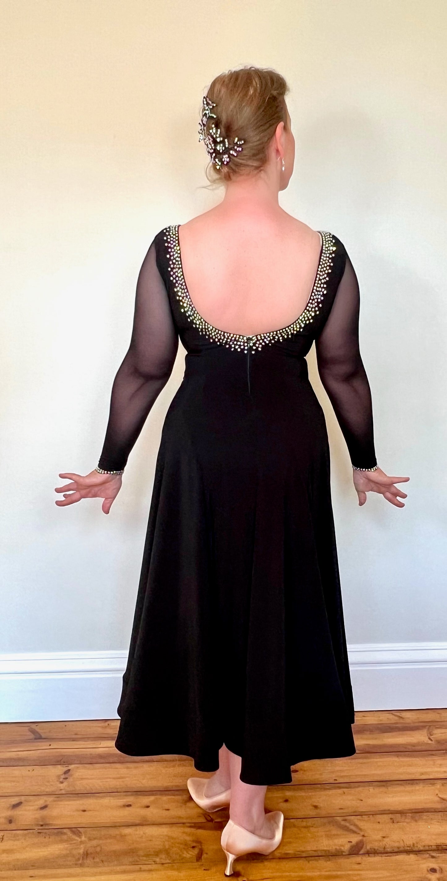 013 Black Crepe Ballroom Dress with AB stoning. Black mesh sleeves & ruched detailing to the chest.