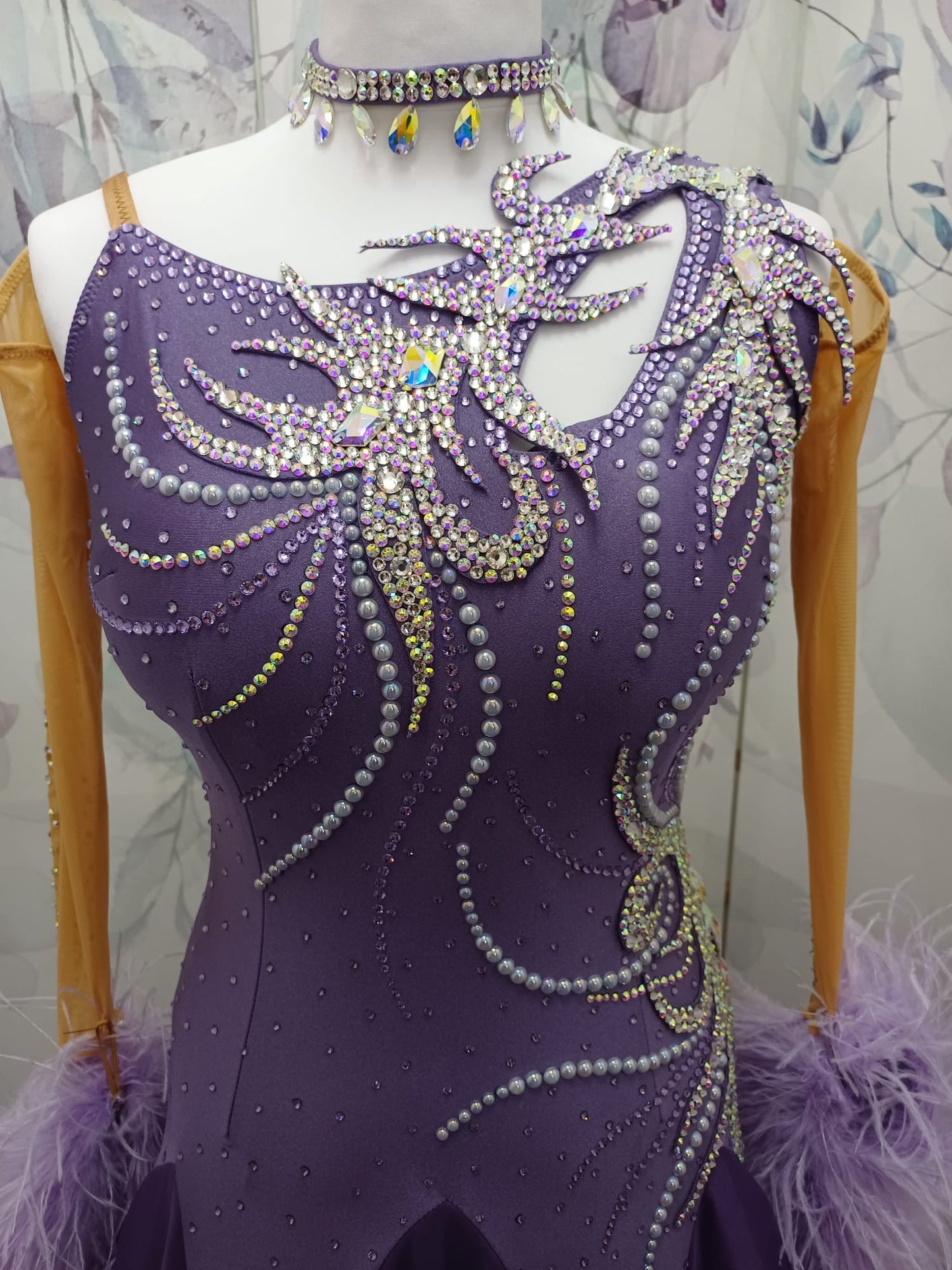 63B Deep Violet Competition Ballroom/Sequence Competition Dance Dress. Heavily stoned in AB, Amethyst & Violet. Motif decoration to upper left shoulder & hip. Feather Boa floats & flesh Gloves. ❤️Showroom Appointments Available❤️