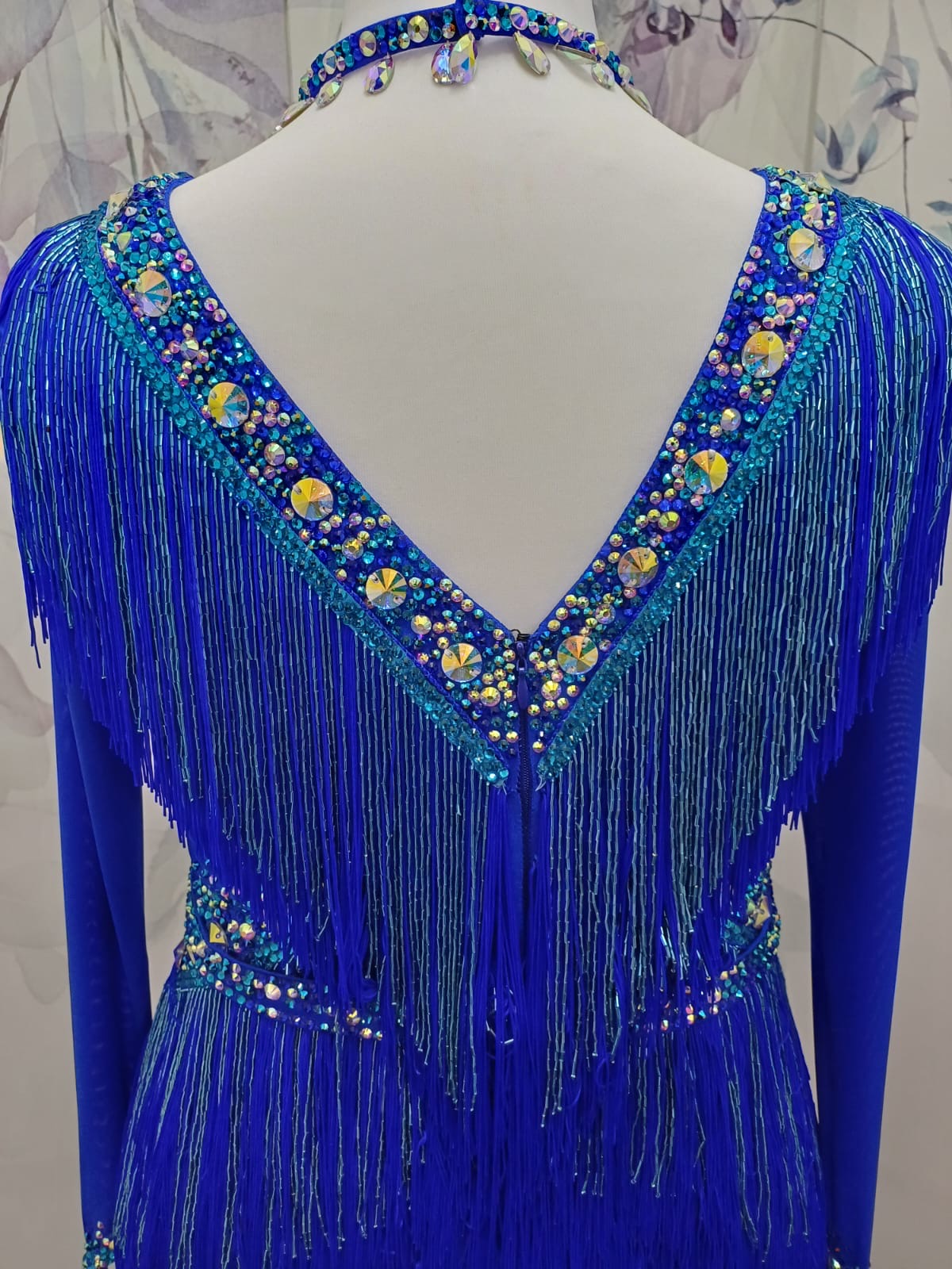 53L Cobalt Blue Competition Latin Dance Dress. Very full fringed skirts with bead droppers to the upper chest & Hip in a contrasting turquoise blue. Heavily stoned in Sapphire & Light Sapphire. ❤️Showroom Appointments Available❤️