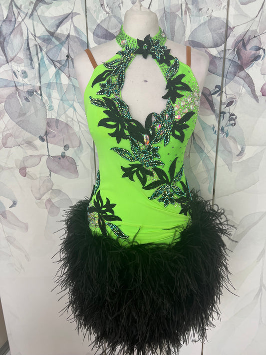 343 Flo Green & Black Latin Dress with keyhole halter neck detail. Strapping design to the back. Full ostrich feather skirt. Decorated with black motifs & stoned in Het AB & AB