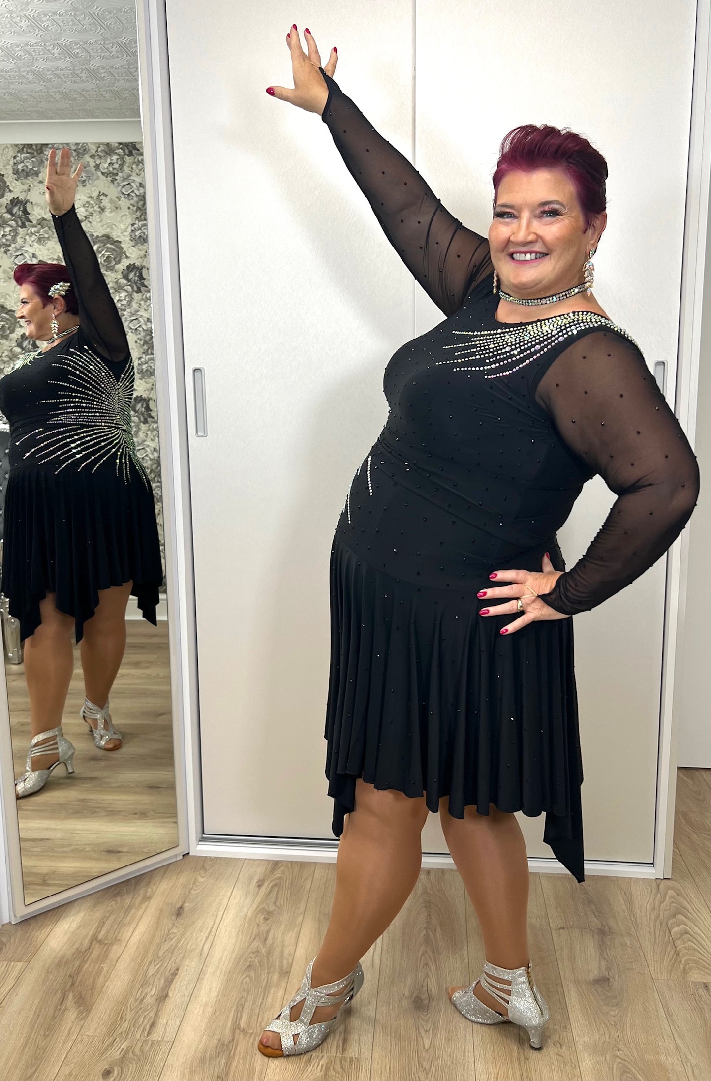 199 Flattering Black Latin Dance Dress. Super Stretchy. Stoned in AB starburst design with handkerchief hem skirt. High back giving option for wearing own bra.