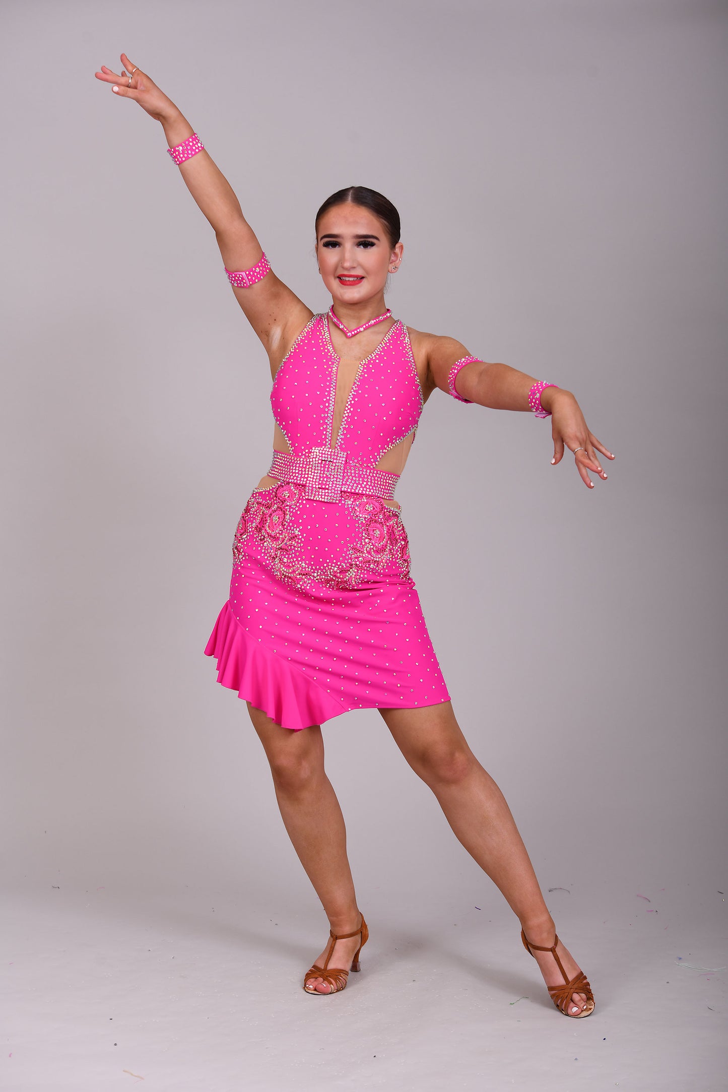 156 Flo Pink cut out Latin Dress. Full frill skirt with detachable belt. Flo pink appliqués decorated in Rose & AB stones