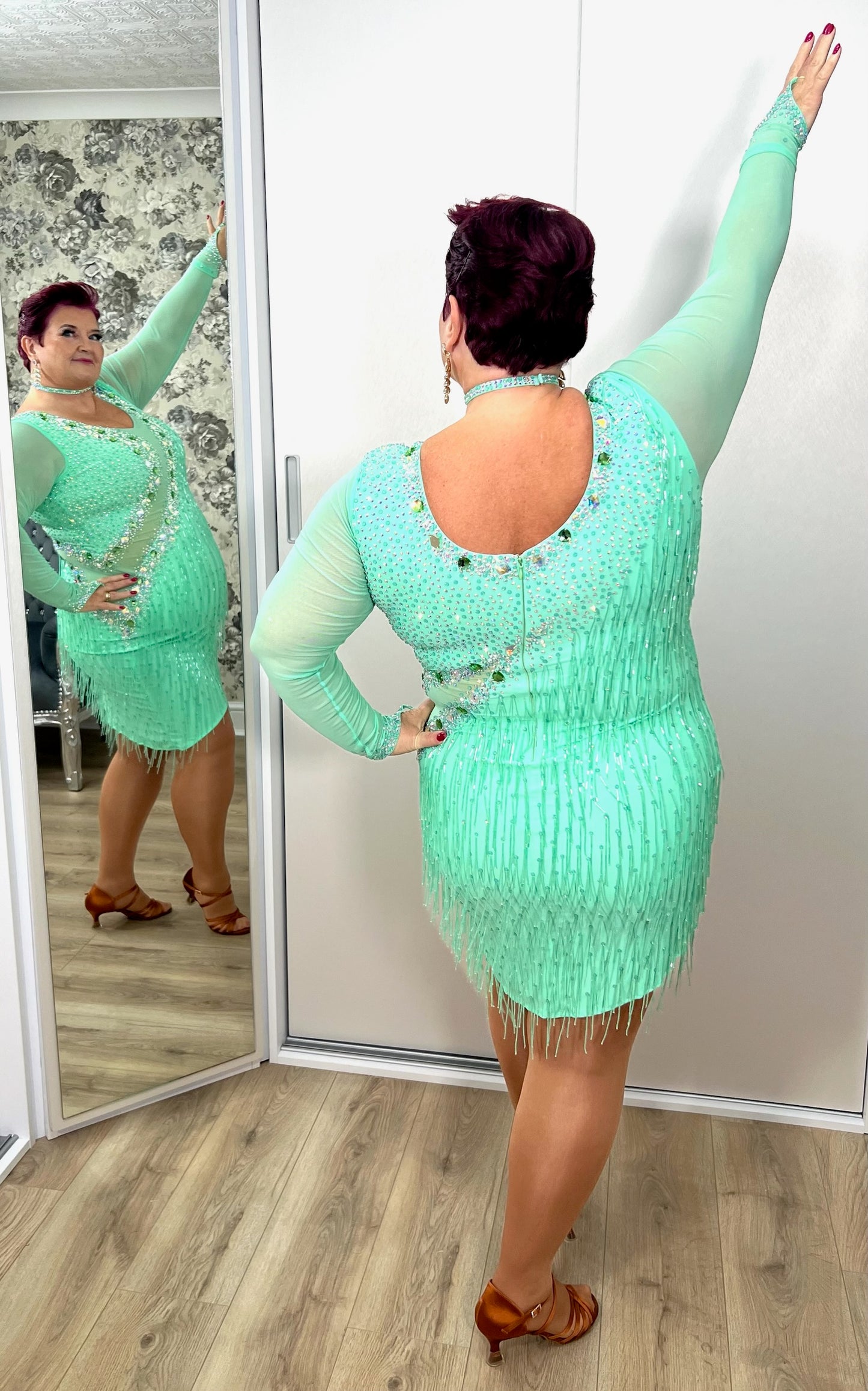 192 Mint Green Latin Dance Dress. Front mesh panel detail with flesh Lycra under so not see through. Stoned in AB and mint ab stones. Mint Green bead droppers. High back giving option to wear own bra.