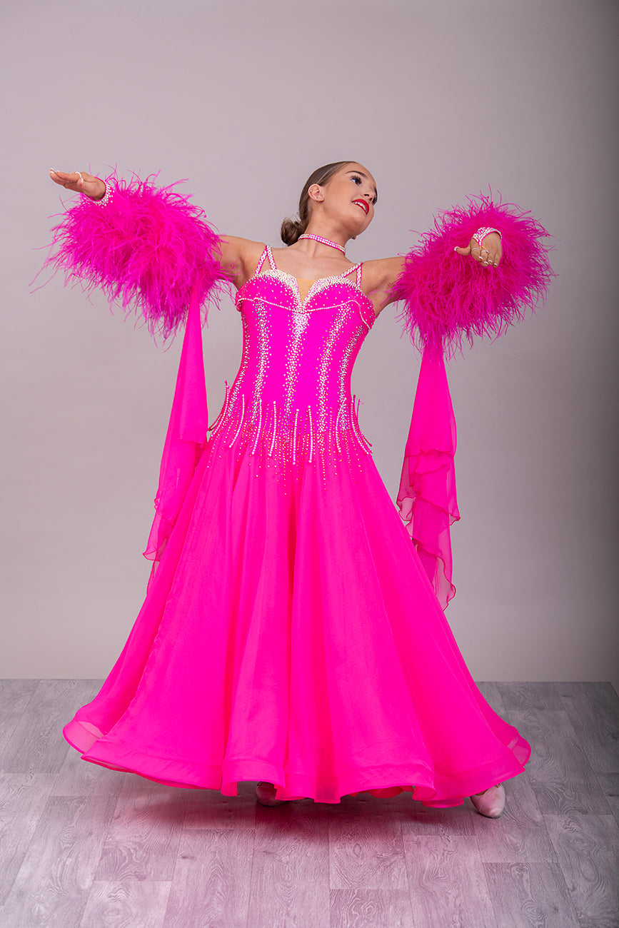 006 Cerise Pink Competition Ballroom/Sequence Dance dress. Comes with Gloves, Floats & Ostrich feathers. Stoned in AB, Rose & Rose AB. 3D detail to the waste.
