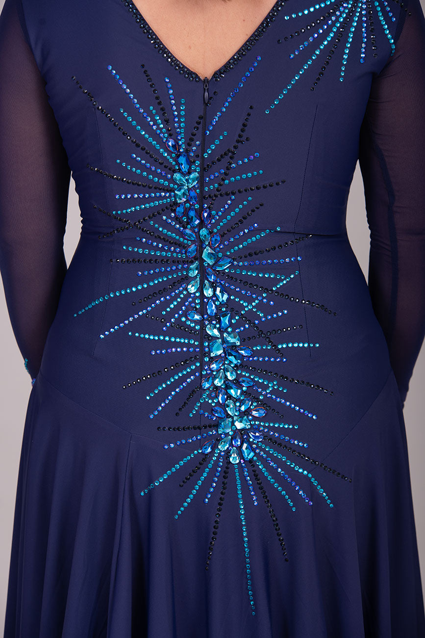 117L Navy Blue Competition Latin Dance Dress. Heavily stoned in Capri blue, Saphire & Capri blue AB. Very full skirts for maximum movement with split to the left side. High back to give option of wearing own Bra