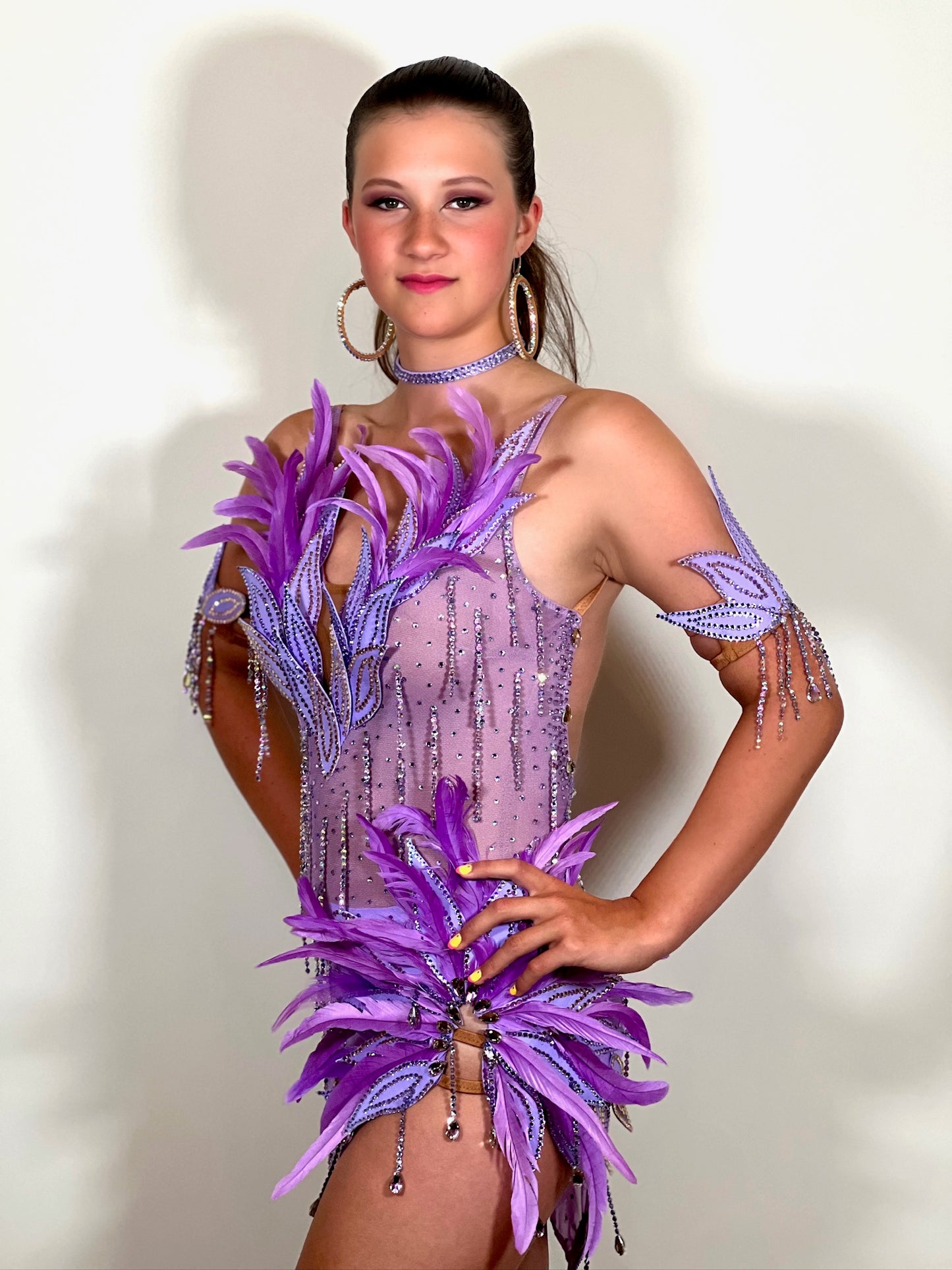 160 Lilac Latin dance dress. Stunning feather detailing to the upper chest & hip. Mesh fabric dress.