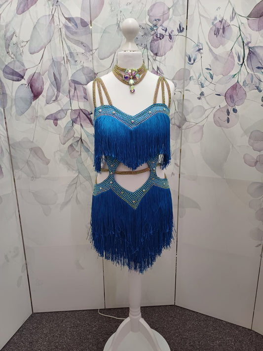 (BUDGET)18 Blue Latin Competition Dance Dress.Full Fringed Skirts with shoulder & waist detailing.2 Bangles included.                                     *****Our New Budget Range are Bought in ready made Costumes, with some detail added by TWDance*****