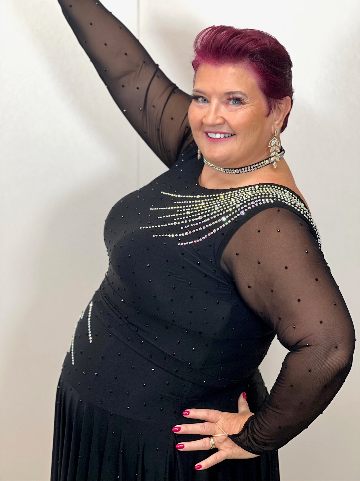 199 Flattering Black Latin Dance Dress. Super Stretchy. Stoned in AB starburst design with handkerchief hem skirt. High back giving option for wearing own bra.