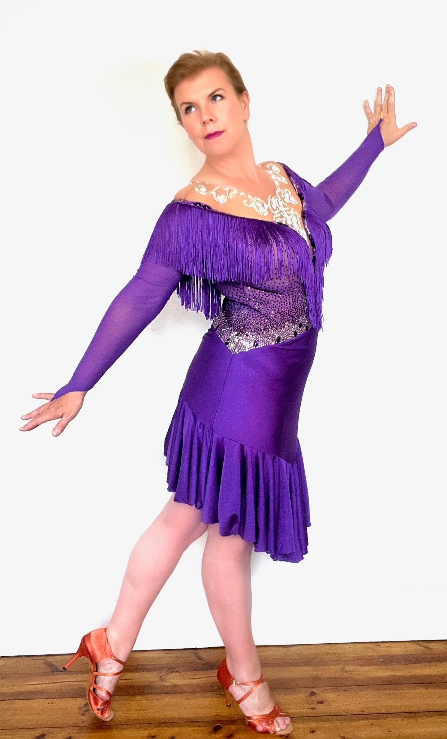 216 Purple Latin Dress with intricate design detailing to the chest & neckline. Heavily fringed at the front & back. AB heavily stoned neckline. Stoned in purple, light rose, magenta & AB
