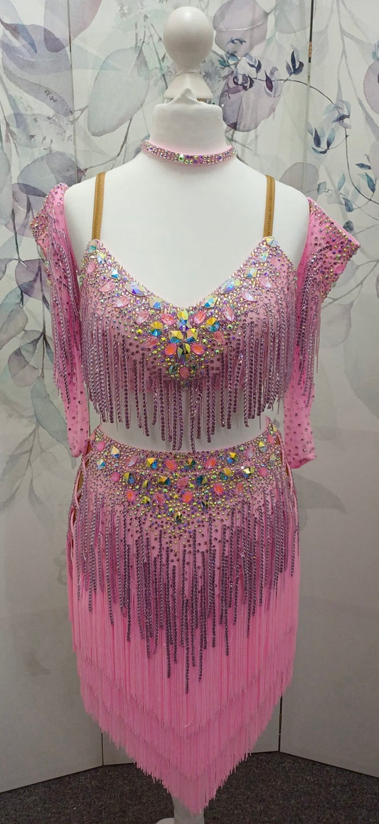 49L Bubblegum Pink Latin Competition 2 piece Dress. Stoned in light rose & bright pink. Stoned fabric droppers throughout. Separate gloves included stoned to match the dress. Length can be shortened to suit. ❤️Showroom Appointments Available❤️