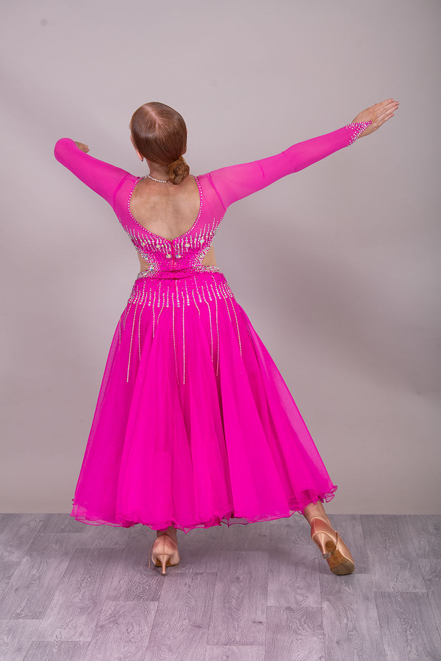 00002 Fuchsia Pink flesh side panel Ballroom Dress. AB stoned material droppers from the waist stoned with Ab throughout