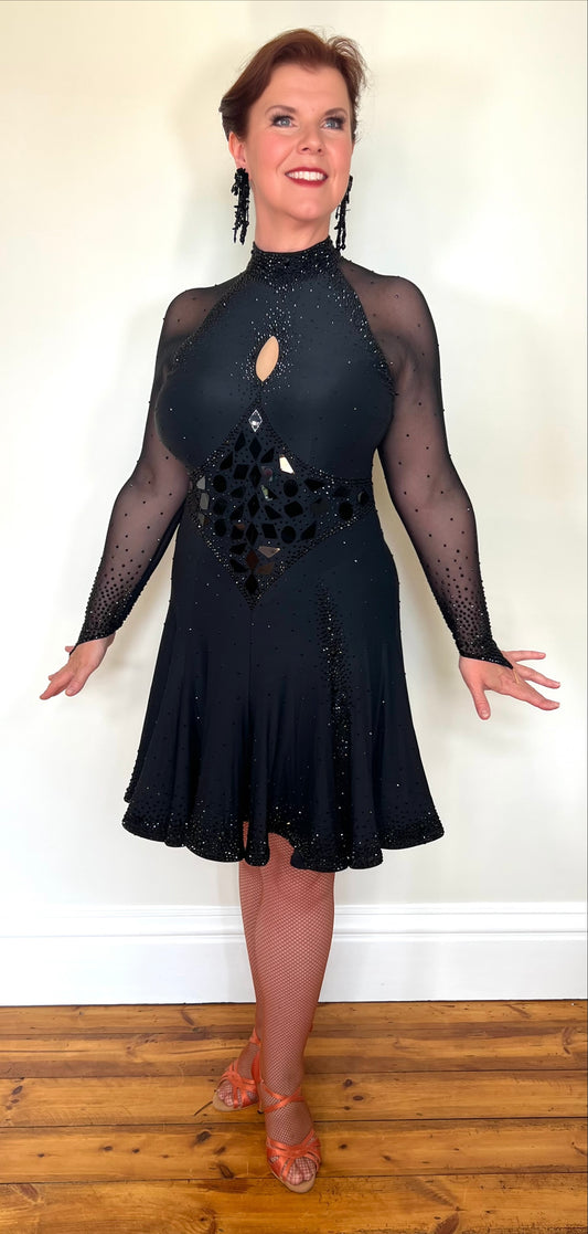 179 Classy Black Latin Dance Dress. Stones in Jet with Jet Mirrors. Stoned Front Side split giving lots of movement to a very full skirt. High back for option of wearing own bra.