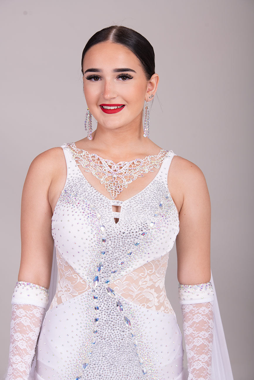 52B TWD “PETITE” Feminine in White with Lace hip inserts Competition Ballroom Dance Dress. Lovely lace Design detail to the upper Bodice. Stoning in AB. Marabou Boa Floats     ❤️Showroom Appointments Available❤️