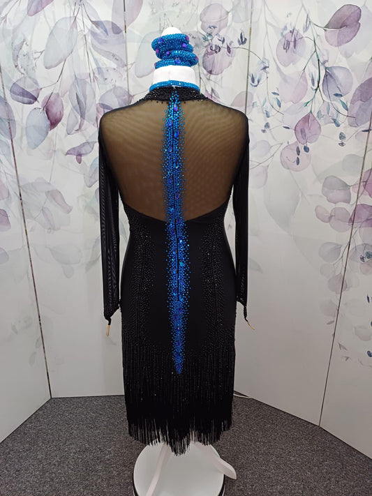 25L Black Longline Competition Latin Dance Dress. Classic cut with fringe & stoned tassels to the skirts. Comes with Blue accessories & 2 necklaces. Blue stoned feature to the back.