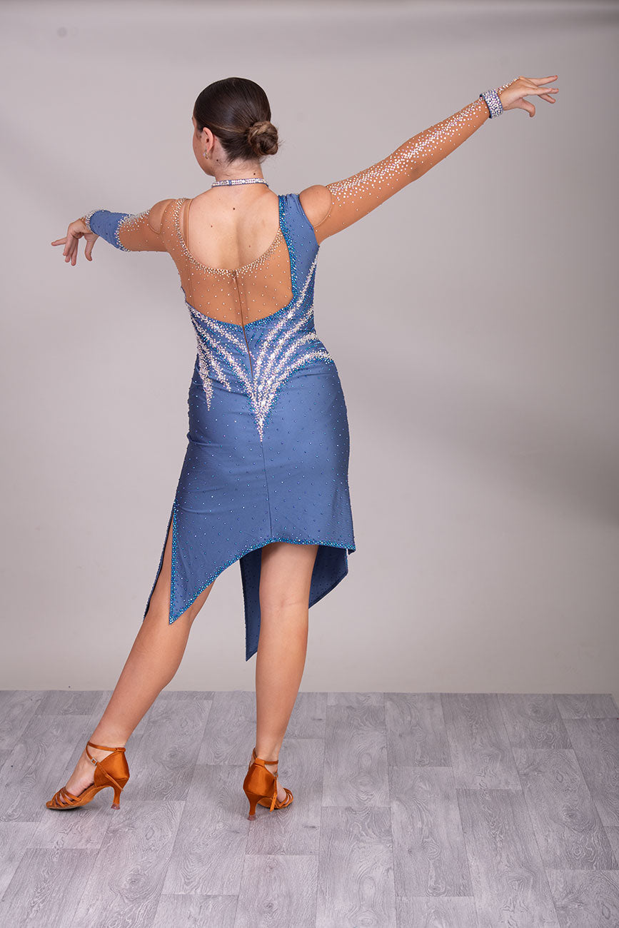 125L Heather Latin Competition Dance Dress. High Back allowing option to wear own Bra. Heather Colour Dress with Cold shoulder sleeves with heavy stoning details. Side splits for maximum leg movement.          Showroom Appointment Available