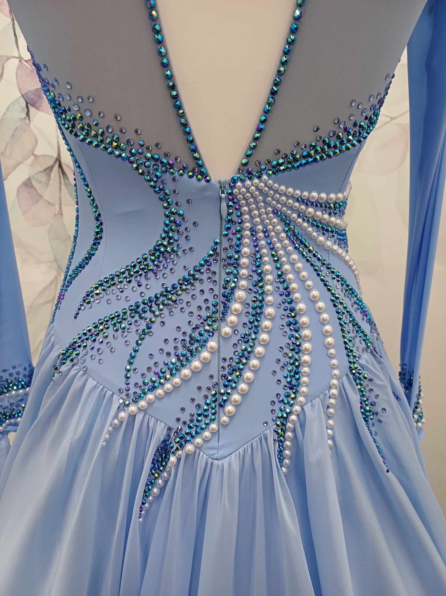 60B TWD ELITE Sky Blue Competition Ballroom/Sequence Dance Dress. New Fuller skirts & Underskirts. Beautiful patterning in Light Sapphire, AB & Light Sapphire AB with White Pearls. Narrow keyhole back. Detachable floats.❤️Showroom Appointments Available❤️
