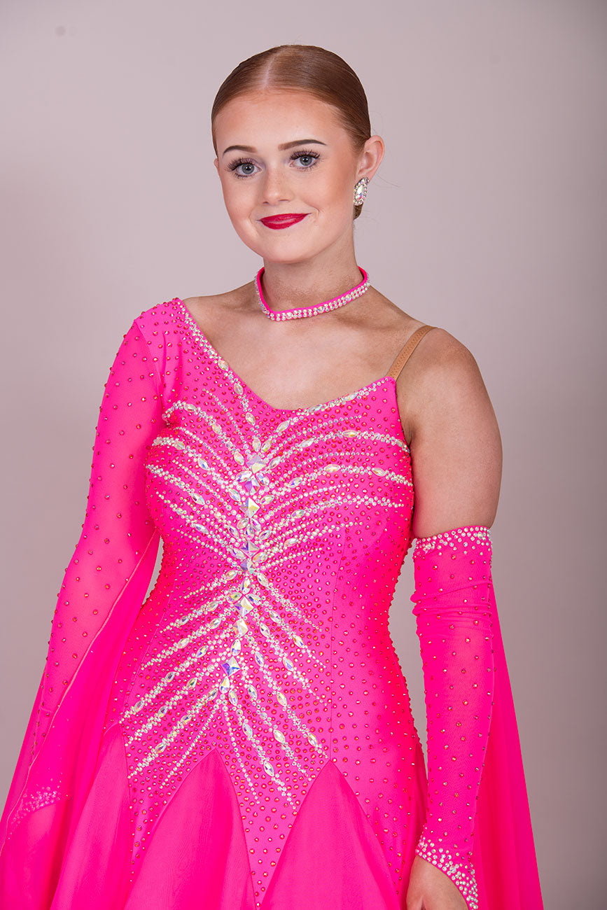 41B TWD PETITE Bright Pink Competition Ballroom/Sequence Dress
Cold Shoulder to one side. Heavily Stoned in AB & Pink. ❤️Showroom Appointments Available❤️