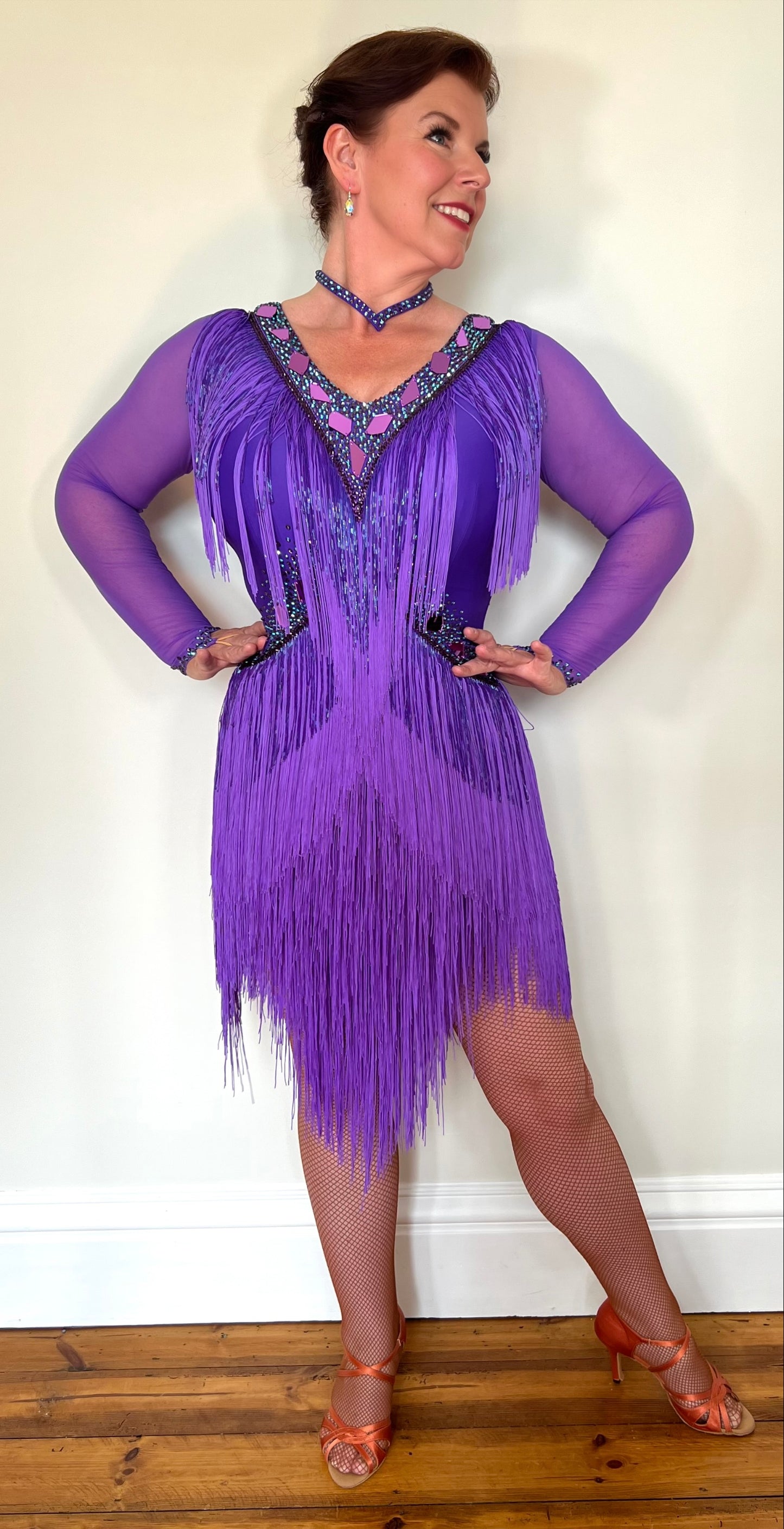 181 Purple Latin Dance Dress. Very full layered fringe. Decorated with purple mirrors, purple bead droppers and purple ab stones. High back to give option for wearing own bra.