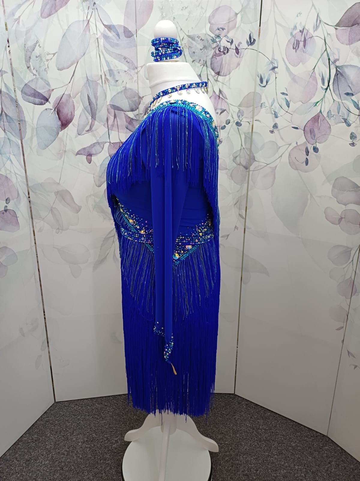53L Cobalt Blue Competition Latin Dance Dress. Very full fringed skirts with bead droppers to the upper chest & Hip in a contrasting turquoise blue. Heavily stoned in Sapphire & Light Sapphire. ❤️Showroom Appointments Available❤️