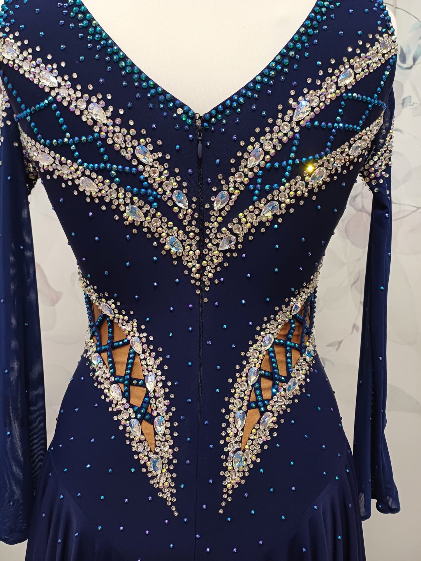 12L Navy Blue Competition Latin/Rhythm Dress. 3D Design to upper chest with flattering detailing to Hips. High back giving option to wear own Bra. Stoned in Blue, Blue AB & AB