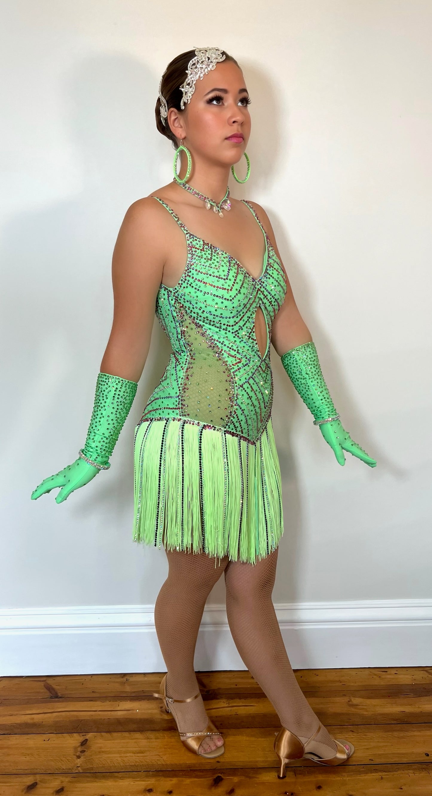 254 Flo Green, fringed skirt Latin Dress. Open detail to the front, with gloves. Decorated in multi coloured stones