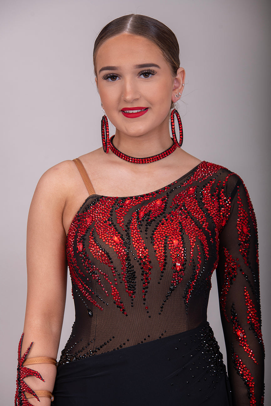 011L Stunning Black & Red Competition Latin  Dance Dress. Black mesh over Tan Lycra bodysuit. Stoned in Light Siam & Jet with decorative wrist/arm cuffs. Full black floaty skirts. Comes with optional black belt.