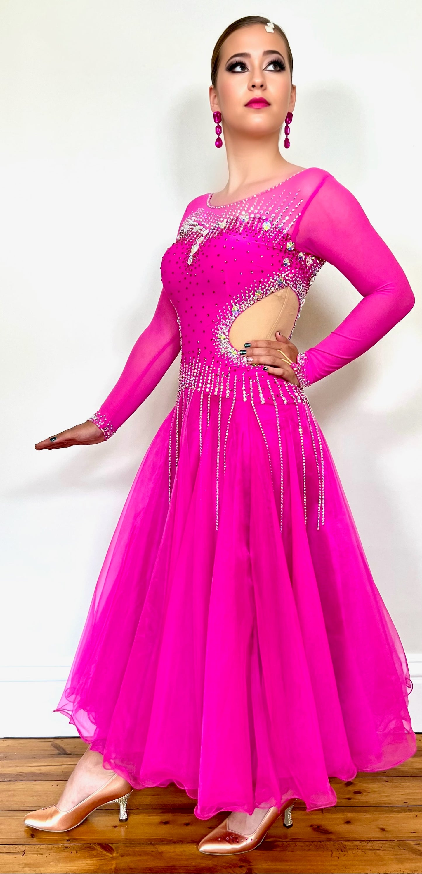 002 Fuchsia Pink flesh side panel Ballroom Dress. AB stoned material droppers from the waist stoned with Ab throughout