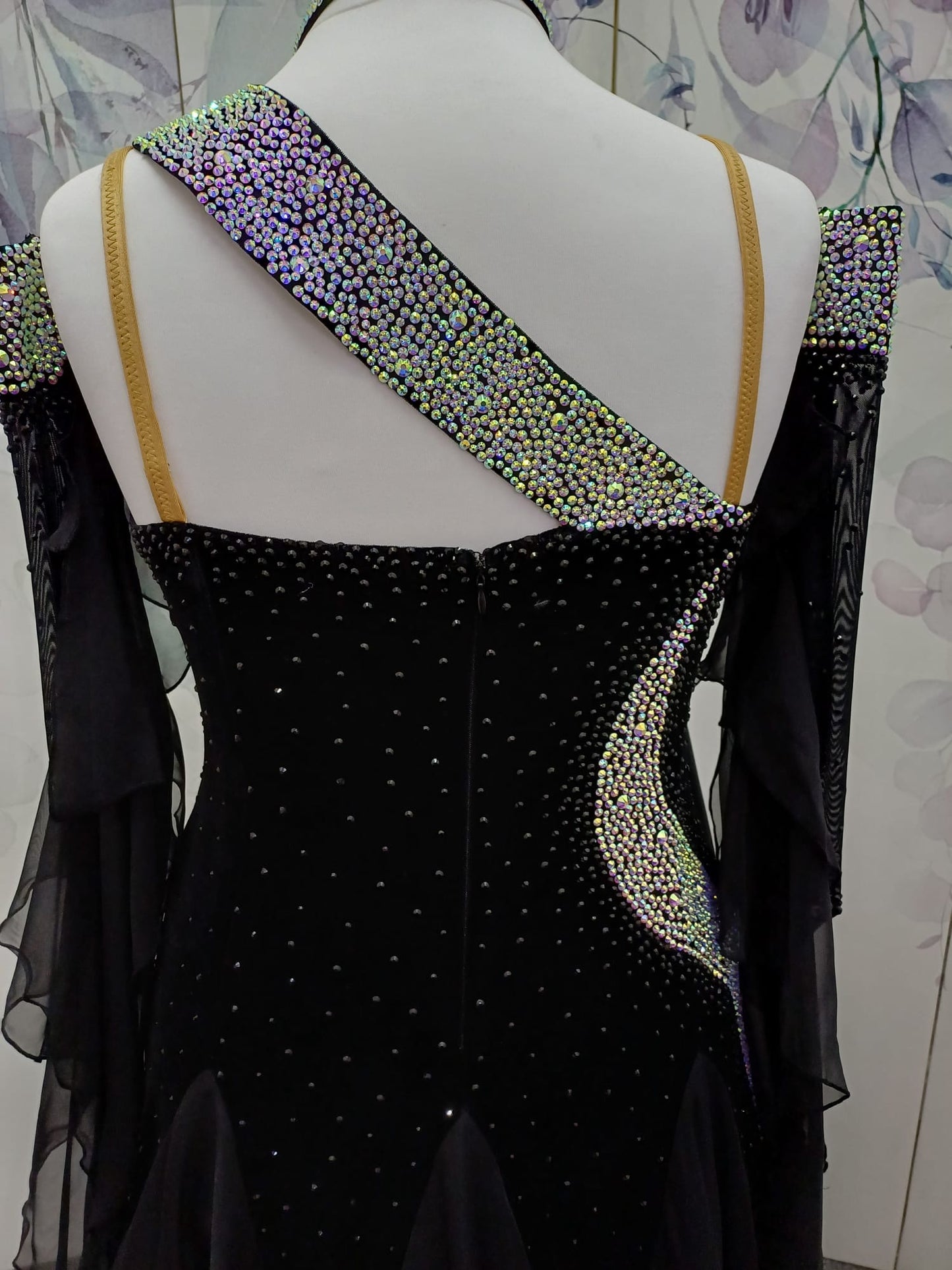 64B Classic Black Competition Ballroom dance dress. Flattering design heavily stoned in AB & Jet. Detachable floats. Satin frill to the front right bodice. Back high enough to wear own bra.