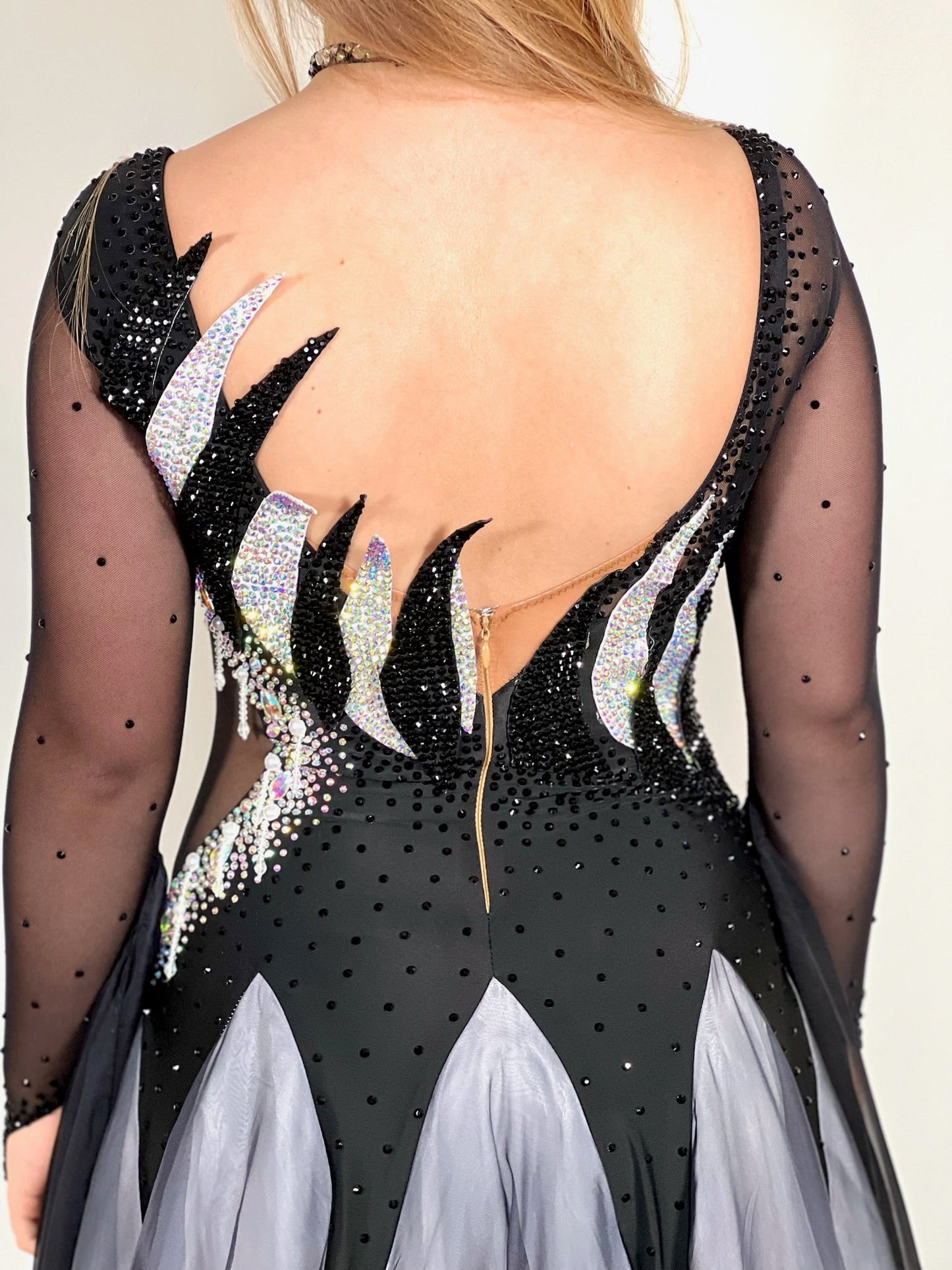 331 White & Black Ombré Ballroom Dress. Detailing to the chest and back. Decorated in Jet and AB stones with floats from the lower arm.