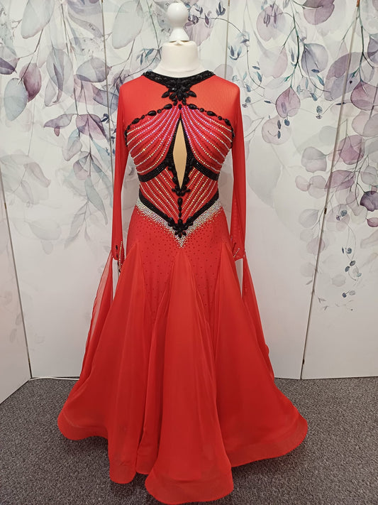 100 Red Competition Ballroom Dance Dress heavily decorated in Siam, Jet & AB. Comes with detachable floats. Lycra panel to the front chest. Distinctive pattern design.