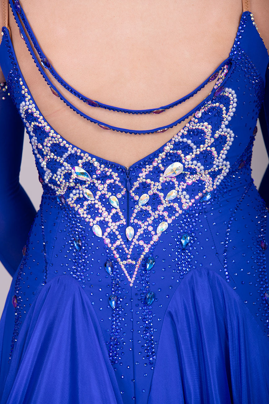34B “TWD ELITE” Ballroom/Sequence Competition Dance Dress New Fuller Skirts & Underskirts. Striking Royal Blue Dress with web design in AB and Sapphire stoning on the bodice. Beautiful back detail with separate gloves


❤️Showroom Appointment Available❤️